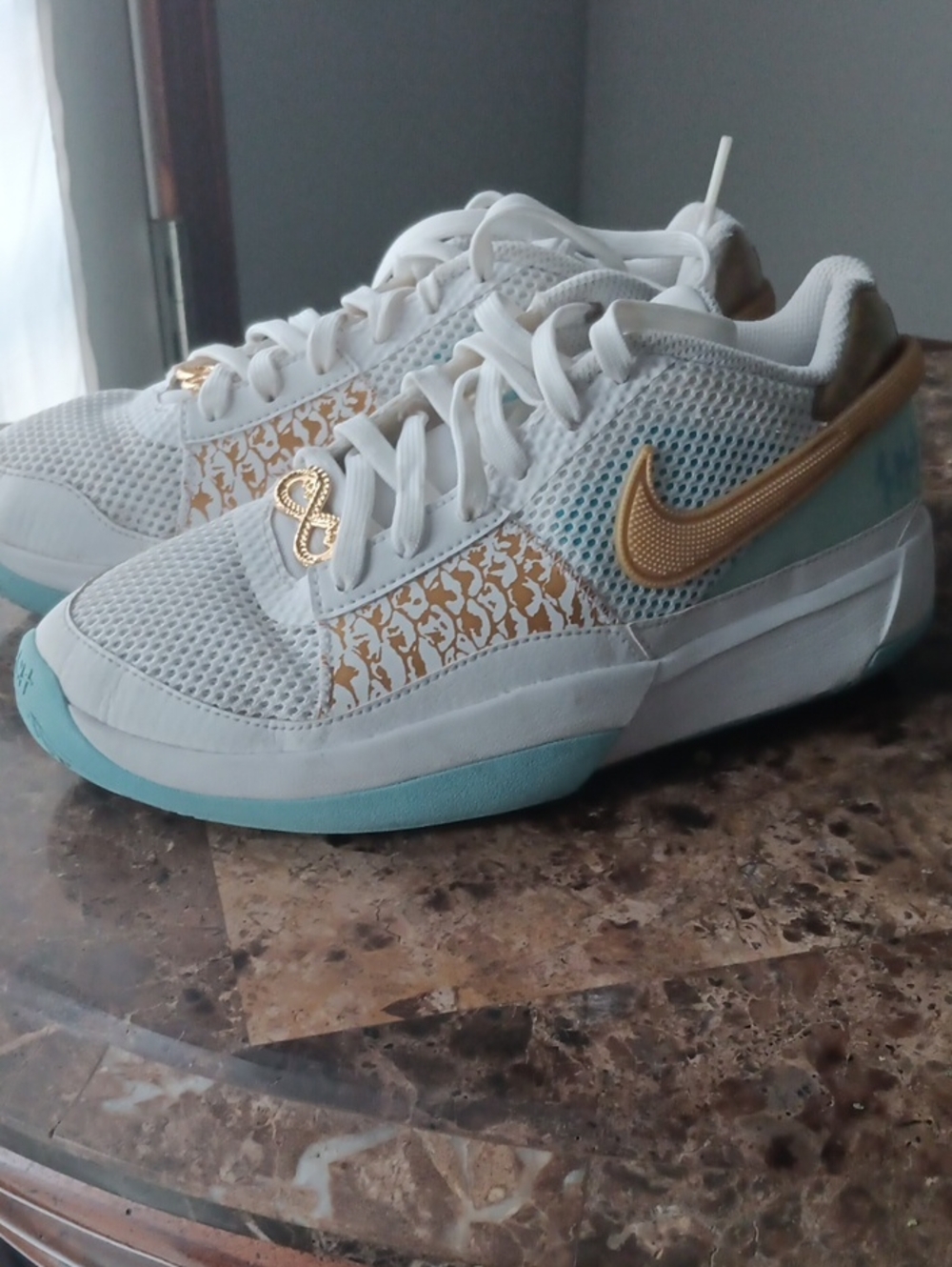 Nike Ja-Morant  White Sneakers with Gold Swoosh and Light Blue Soles